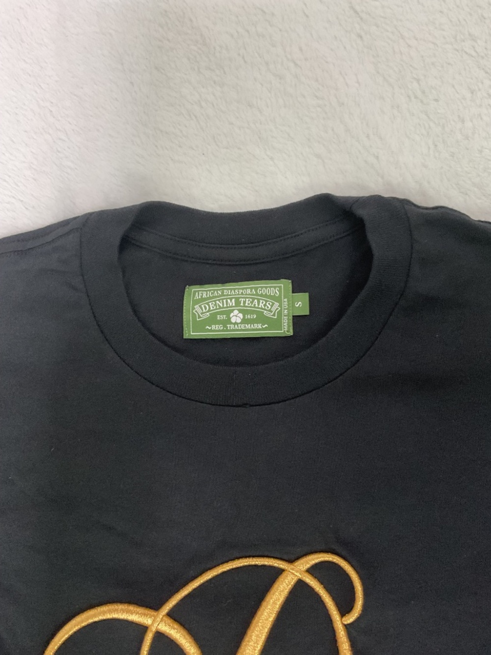Denim Tears black signature t-shirt with gold cursive 'DT' logo, size Small - Picture 3 of 4